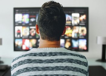 Student watching movies about university lifestyle